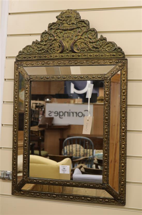 A French embossed brass wall mirror W.48cm